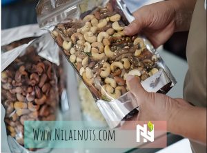 a person holding a bag of nuts